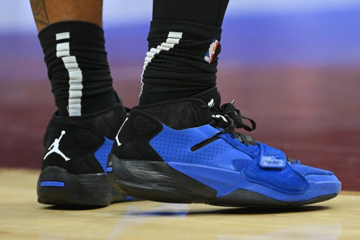 View of blue and black Zion shoes.